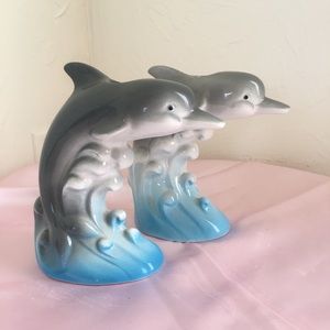 Set of dolphin candle holders